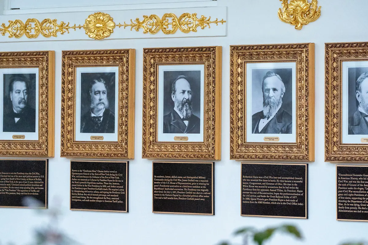 New-plaques-of-explanatory-text-have-been-placed-underneath-presidential-portraits-on-the-Colonnade-at-the-White-House-Wednesday-Dec-17-2025-in-Washington