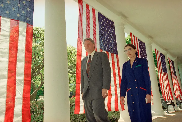 President-Bill-Clinton-and-Judge-Ruth-Bader-Ginsburg-walk-along-the-Colonnades-of-the-White-House-on-Monday-June-14-1993-in-Washington-as-they-head-to-the-Rose-Garden-for-a-news-conference-The-president-nominated-Ginsburg-to-flll-the-vacancy-on-the-Supreme-Court