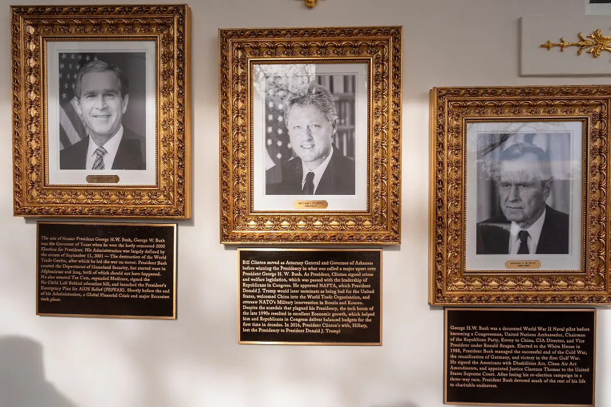 New-plaques-of-explanatory-text-have-been-placed-underneath-presidential-portraits-on-the-Colonnade-at-the-White-House-Wednesday-Dec-17-2025-in-Washington