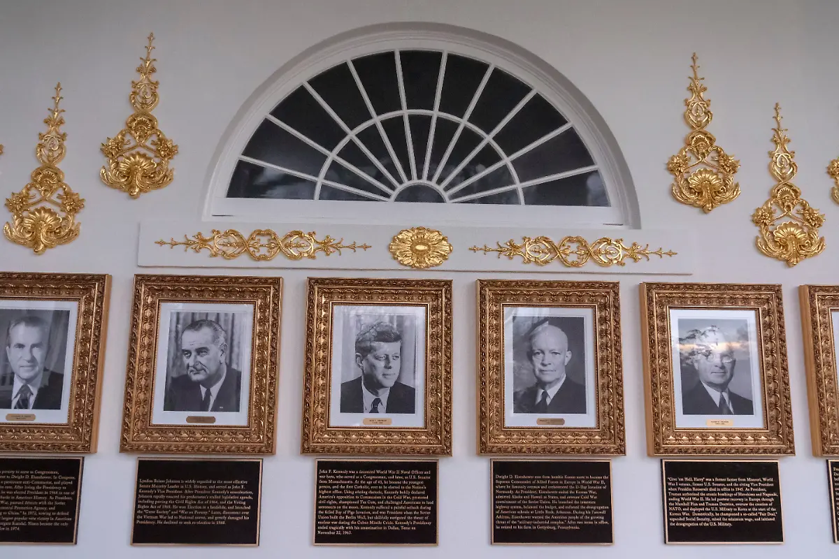 Portraits-of-former-Presidents-Richard-Nixon-Lyndon-Johnson-John-F-Kennedy-Dwight-Eisenhower-and-Harry-Truman-with-plaques-of-text-below-are-seen-on-the-Presidential-Walk-of-Fame-on-the-Colonnade-of-the-White-House-Wednesday-Dec-17-2025-in-Washington