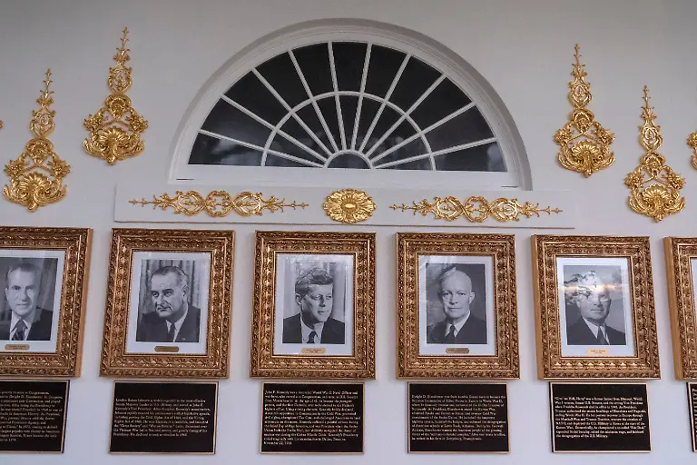 Portraits-of-former-Presidents-Richard-Nixon-Lyndon-Johnson-John-F-Kennedy-Dwight-Eisenhower-and-Harry-Truman-with-plaques-of-text-below-are-seen-on-the-Presidential-Walk-of-Fame-on-the-Colonnade-of-the-White-House-Wednesday-Dec-17-2025-in-Washington
