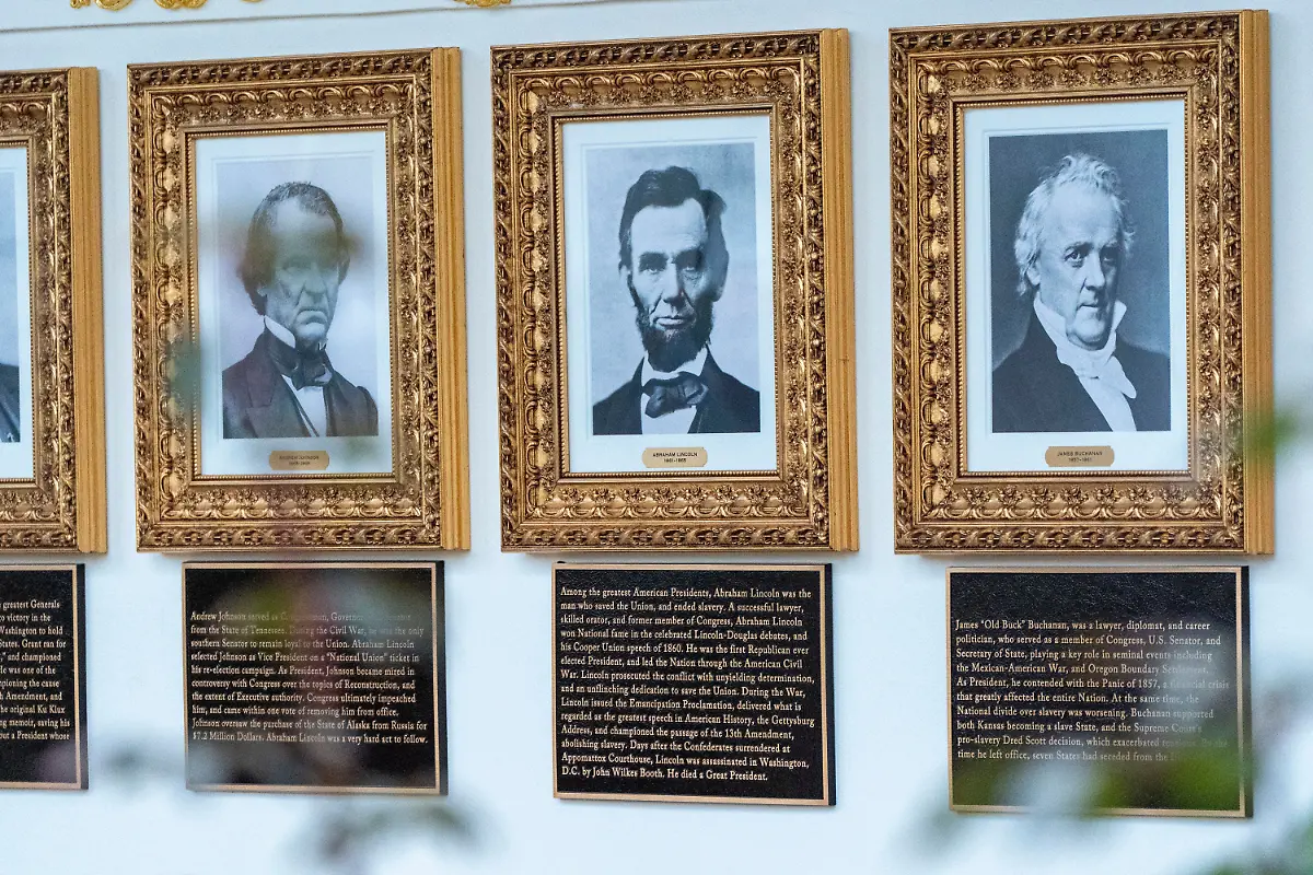 New-plaques-of-explanatory-text-have-been-placed-underneath-presidential-portraits-on-the-Colonnade-at-the-White-House-Wednesday-Dec-17-2025-in-Washington
