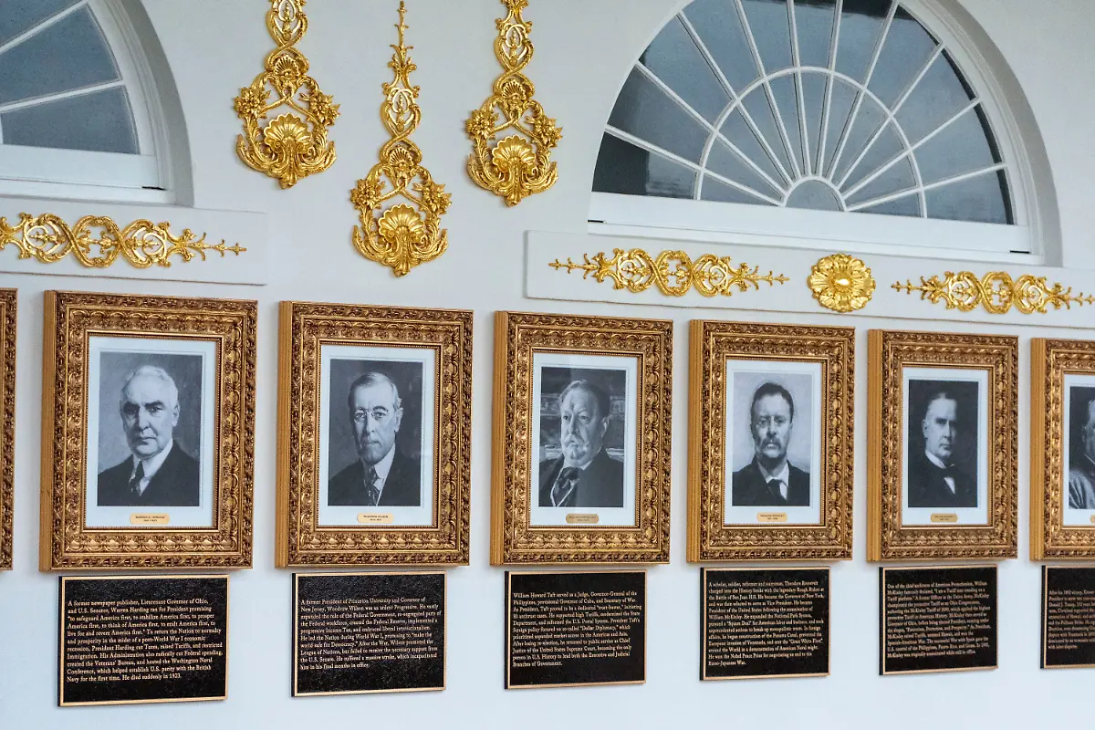 New-plaques-of-explanatory-text-have-been-placed-underneath-presidential-portraits-on-the-Colonnade-at-the-White-House-Wednesday-Dec-17-2025-in-Washington