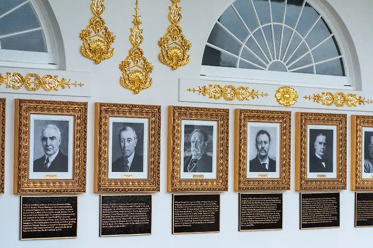 New-plaques-of-explanatory-text-have-been-placed-underneath-presidential-portraits-on-the-Colonnade-at-the-White-House-Wednesday-Dec-17-2025-in-Washington