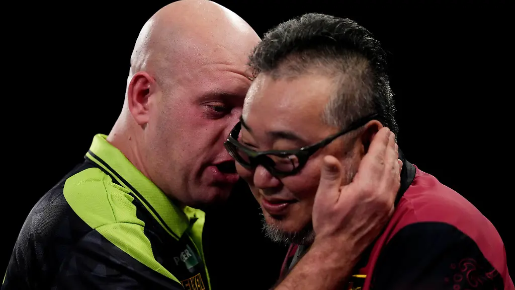 Michael-van-Gerwen-left-speaks-with-Mitsuhiko-Tatsunami-after-winning-their-match-on-day-eight-of-the-Paddy-Power-World-Darts-Championship-at-the-Alexandra-Palace-in-London-Thursday-Dec-18-2025