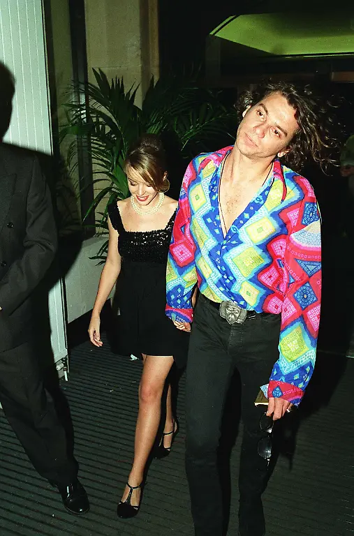 KYLIE-MINOGUE-Australian-Actress-and-Pop-Singer-with-MICHAEL-HUTCHENCE-Australian-Pop-Musician-Member-of-the-group-INXS-Attending-the-London-premiere-of-the-film-Dick-Tracy-Universal-Pictorial-Press-Photo-UIW-000909-D-28-05-07