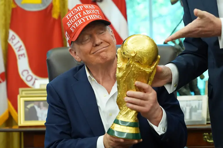 President-Donald-Trump-holds-the-FIFA-World-Cup-Winners-Trophy-during-an-announcement-in-the-Oval-Office-of-the-White-House-Friday-Aug-22-2025-in-Washington