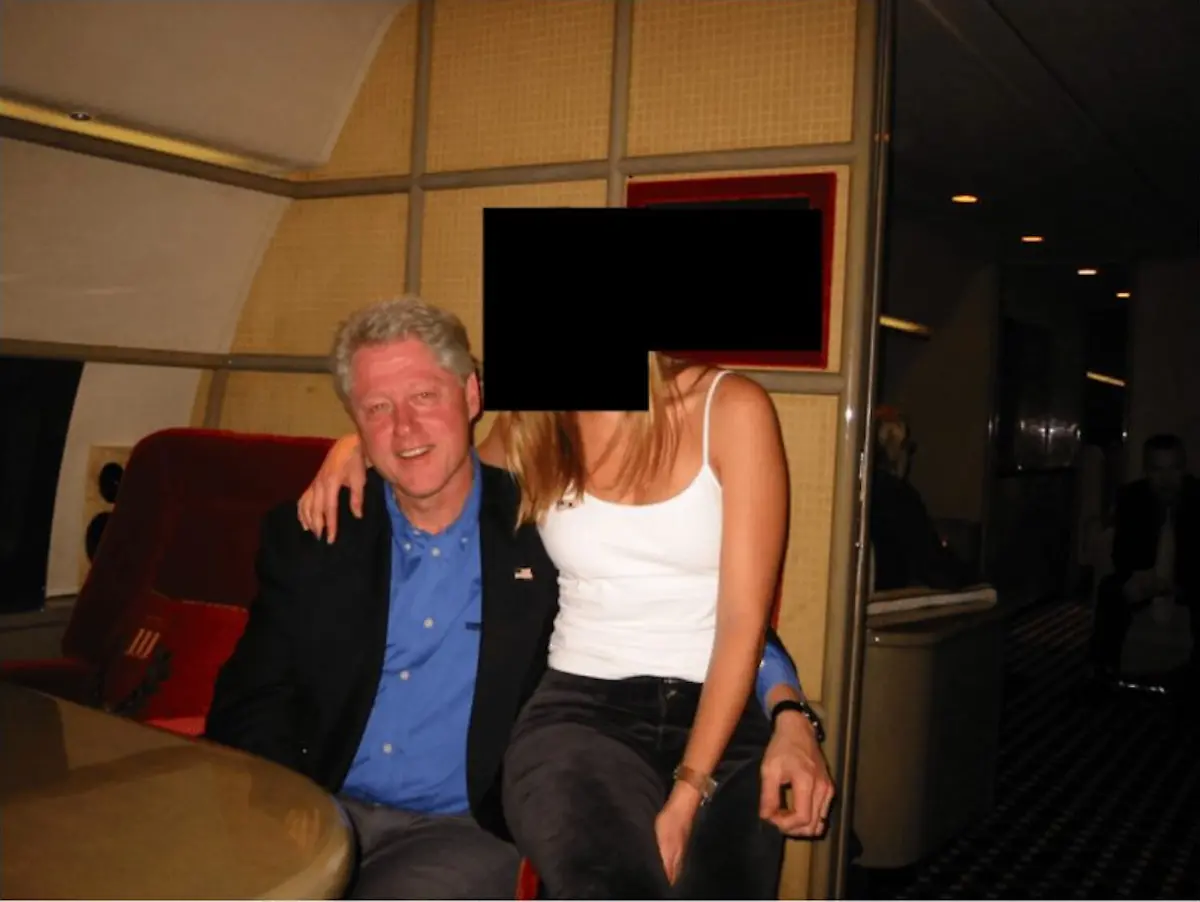 December-19-2025-Unknown-Unknown-Unknown-DATE-and-LOCATION-UNIDENTIFIED-The-Department-Of-Justice-has-released-files-tied-to-convicted-sex-offender-Jeffrey-Epstein-Former-President-BILL-CLINTON-with-a-women-whose-face-is-redacted-in-the-photo