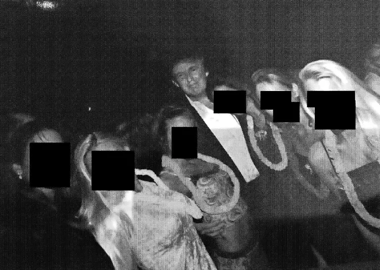 DATE-and-LOCATION-UNIDENTIFIED-One-of-80-images-released-December-12-2025-of-the-95-000-photos-subpoenaed-by-United-States-House-Committee-on-Oversight-and-Reform-after-President-Trump-signs-on-November-19-2025-the-Epstein-Files-Transparency-Act-making-for-all-documents-in-evidence-made-public-by-December-19-2025-One-of-the-80-released-today-DONALD-TRUMP-poses-with-a-group-of-women-The-women-s-faces-were-redacted-by-Democrats-on-the-House-Oversight-Committee-Friday-released-from-the-late-convicted-sex-offender-Epstein-s-estate