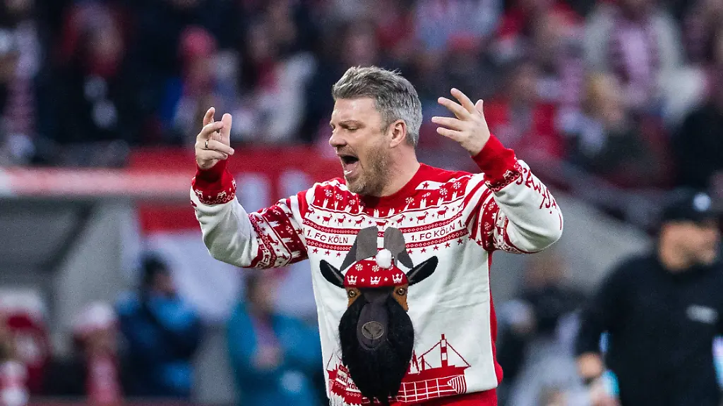 Koeln-RheinEnergieStadion-22-12-2025-Head-coach-Lukas-Kwasniok-of-Koeln-with-Geissbock-Hennes-Christmas-Sweater-reacts-during-the-1-Bundesliga-match-1-FC-Koeln-vs-FC-Union-Berlin