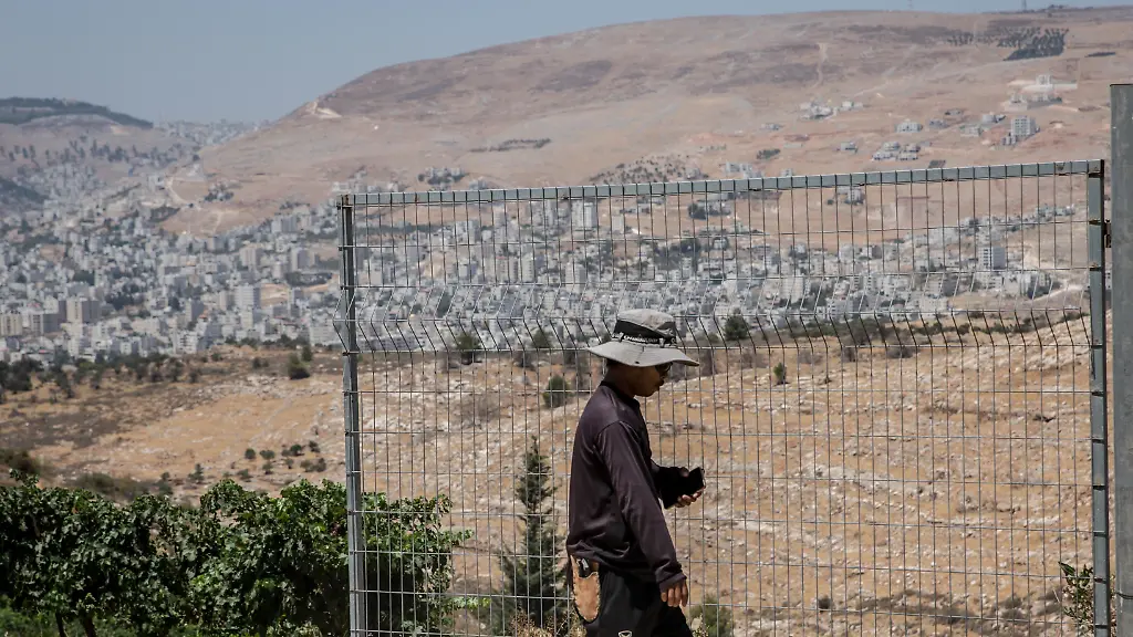 A-Thai-worker-seen-in-a-vineyard-run-by-Israeli-settlers-in-the-settlement-of-Elon-Moreh-which-is-considered-illegal-under-international-law-More-than-700-000-Israeli-settlers-live-between-the-occupied-West-Bank-and-East-Jerusalem-despite-the-settlements-being-considered-illegal-under-international-law-Settlers-refer-to-the-West-Bank-as-Judea-and-Samaria-and-say-they-have-a-biblical-right-to-be-there