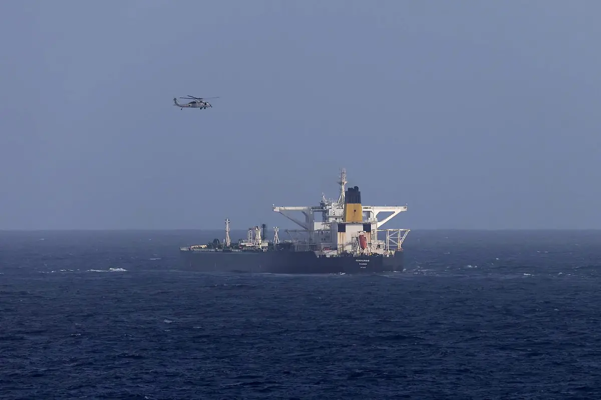 A-U-S-military-helicopter-flies-over-the-Panama-flagged-Centuries-which-was-intercepted-by-the-U-S-Coast-Guard-days-after-U-S-President-Donald-Trump-announced-a-blockade-of-all-sanctioned-oil-tankers-entering-and-leaving-Venezuela-east-of-Barbados-in-the-Caribbean-Sea-December-20-2025