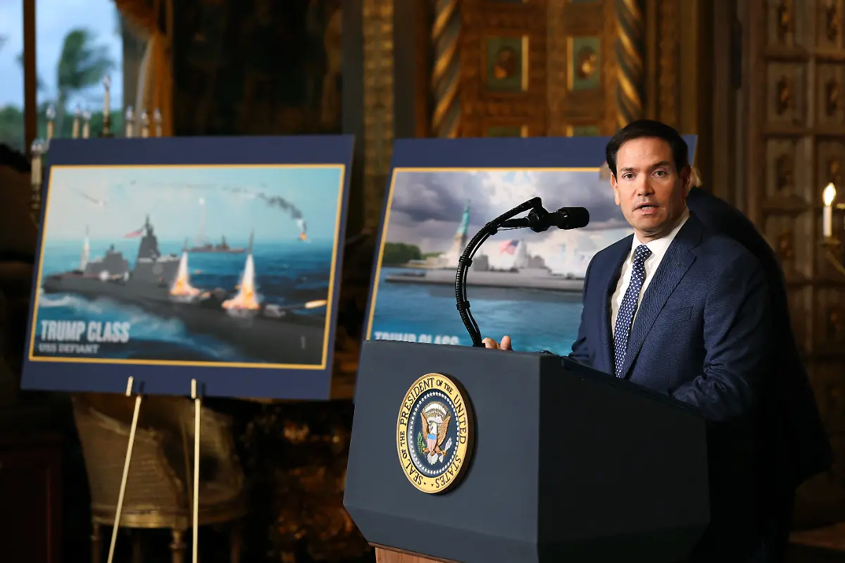 PALM-BEACH-FLORIDA-DECEMBER-22-U-S-Secretary-of-State-Marco-Rubio-speaks-after-U-S-President-Donald-Trump-announced-the-creation-of-the-Trump-class-battleship-at-Trumps-Mar-a-Lago-estate-on-December-22-2025-in-Palm-Beach-Florida-Trump-announced-the-creation-of-the-new-Trump-class-battleship-which-will-become-the-centerpiece-of-the-presidents-Golden-Fleet-program-to-rebuild-and-strengthen-U-S-shipbuilding