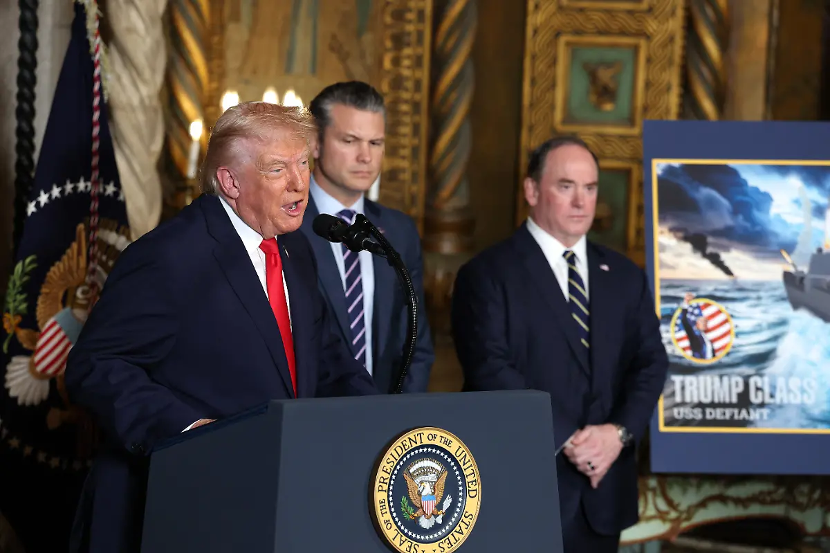 PALM-BEACH-FLORIDA-DECEMBER-22-U-S-President-Donald-Trump-joined-by-Secretary-of-War-Pete-Hegseth-and-Secretary-of-the-Navy-John-Phelan-announces-the-creation-of-the-Trump-class-battleship-during-a-statement-to-the-media-at-Trumps-Mar-a-Lago-estate-on-December-22-2025-in-Palm-Beach-Florida-Trump-announced-the-new-class-of-ship-will-become-the-centerpiece-of-his-Golden-Fleet-program-to-rebuild-and-strengthen-the-U-S-shipbuilding-industry
