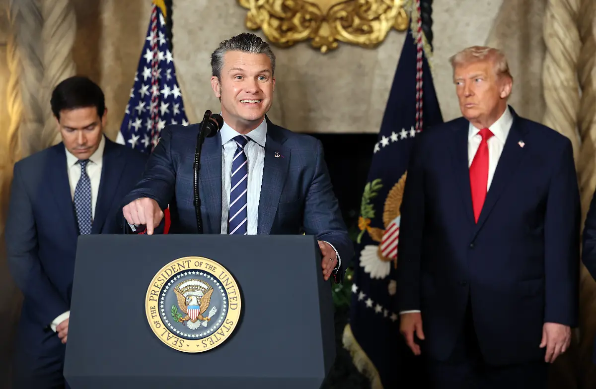 PALM-BEACH-FLORIDA-DECEMBER-22-U-S-Secretary-of-War-Pete-Hegseth-speaks-alongside-U-S-Secretary-of-State-Marco-Rubio-and-U-S-President-Donald-Trump-as-Trump-announces-the-creation-of-the-Trump-class-battleship-during-a-statement-to-the-media-at-Trumps-Mar-a-Lago-estate-on-December-22-2025-in-Palm-Beach-Florida-Trump-announced-the-created-of-the-new-Trump-class-battleship-which-will-become-the-centerpiece-of-the-presidents-Golden-Fleet-program-to-rebuild-and-strengthen-U-S-shipbuilding