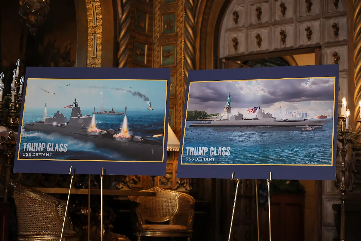 Renderings-of-Trump-Class-USS-Defiant-are-displayed-on-the-day-U-S-President-Donald-Trump-makes-an-announcement-about-the-Navy-s-Golden-Fleet-at-Mar-a-lago-in-Palm-Beach-Florida-U-S-December-22-2025