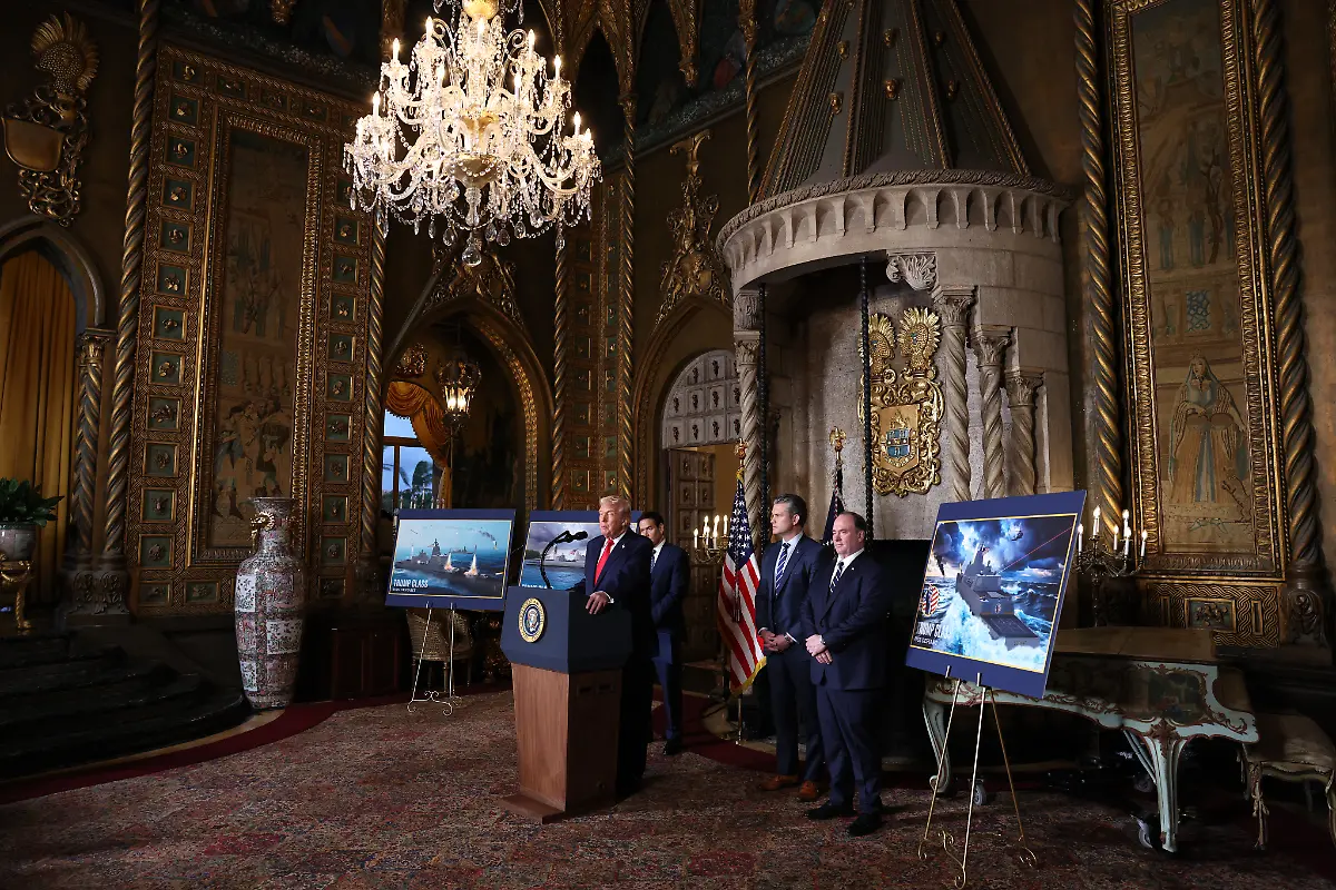 PALM-BEACH-FLORIDA-DECEMBER-22-U-S-President-Donald-Trump-joined-by-Secretary-of-State-Marco-Rubio-Secretary-of-War-Pete-Hegseth-and-Secretary-of-the-Navy-John-Phelan-announces-the-creation-of-the-Trump-class-battleship-during-a-statement-to-the-media-at-Trumps-Mar-a-Lago-estate-on-December-22-2025-in-Palm-Beach-Florida-Trump-announced-the-created-of-the-new-Trump-class-battleship-which-will-become-the-centerpiece-of-the-presidents-Golden-Fleet-program-to-rebuild-and-strengthen-U-S-shipbuilding