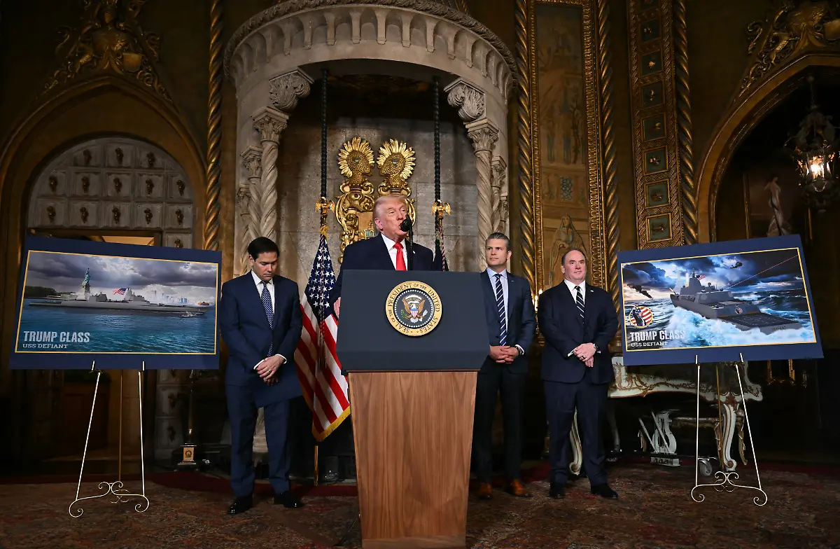 US-President-Donald-Trump-announces-the-US-Navys-new-Golden-Fleet-initiative-unveiling-a-new-class-of-warships-at-Mar-a-Lago-in-Palm-Beach-Florida-on-December-22-2025-President-Donald-Trump-on-December-22-announced-a-new-class-of-heavily-armed-warships-that-will-be-named-after-himself-an-honor-usually-reserved-for-US-leaders-who-have-left-office-Two-of-the-Trump-class-ships-will-be-built-initially-but-that-number-could-grow-substantially-in-the-future-according-to-the-president-who-said-they-will-be-some-of-the-most-lethal-surface-warfare-ships-and-the-largest-battleship-in-the-history-of-our-country-Trump-made-the-announcement-at-his-Mar-a-Lago-residence-in-Florida-alongside-Pentagon-chief-Pete-Hegseth-Secretary-of-State-Marco-Rubio-and-Navy-Secretary-John-Phelan-with-images-of-the-planned-high-tech-vessels-on-stands-nearby
