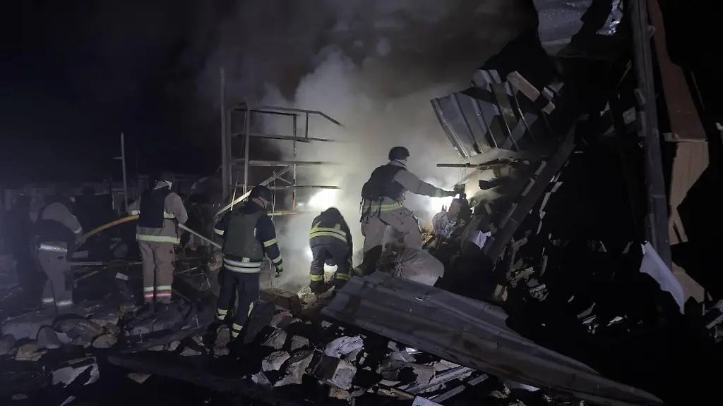 ZAPORIZHZHIA-UKRAINE-DECEMBER-24-EDITORIAL-USE-ONLY-MANDATORY-CREDIT-UKRAINIAN-STATE-EMERGENCY-SERVICE-HANDOUT-NO-MARKETING-NO-ADVERTISING-CAMPAIGNS-DISTRIBUTED-AS-A-SERVICE-TO-CLIENTS-A-view-of-destroyed-residential-building-as-search-and-rescue-and-firefighting-efforts-continue-after-Russian-forces-carried-out-airstrikes-on-the-city-of-Zaporizhzhia-in-Ukraine-on-December-24-2025-According-to-authorities-at-least-four-people-were-injured-and-received-medical-assistance-The-strikes-caused-fires-in-a-garage-and-a-car-which-were-quickly-extinguished-by-rescuers-The-blast-wave-also-partially-damaged-a-fire-station-administrative-buildings-multi-storey-residential-buildings-an-educational-institution-and-several-vehicles