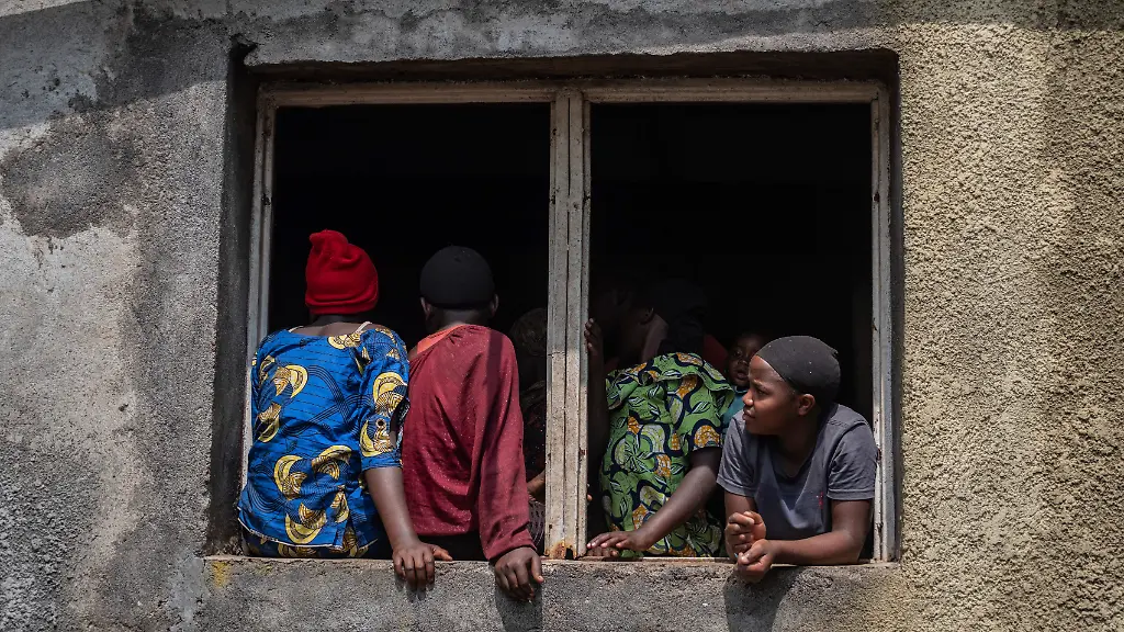 Residents-listen-to-Tom-Fletcher-Under-Secretary-General-for-Humanitarian-Affairs-and-Emergency-Relief-Coordinator-at-the-Office-for-the-Coordination-of-Humanitarian-Affairs-OCHA-during-his-visit-to-North-Kivu-s-town-of-Buhumba-Democratic-republic-of-the-Congo-Thursday-June-26-2025