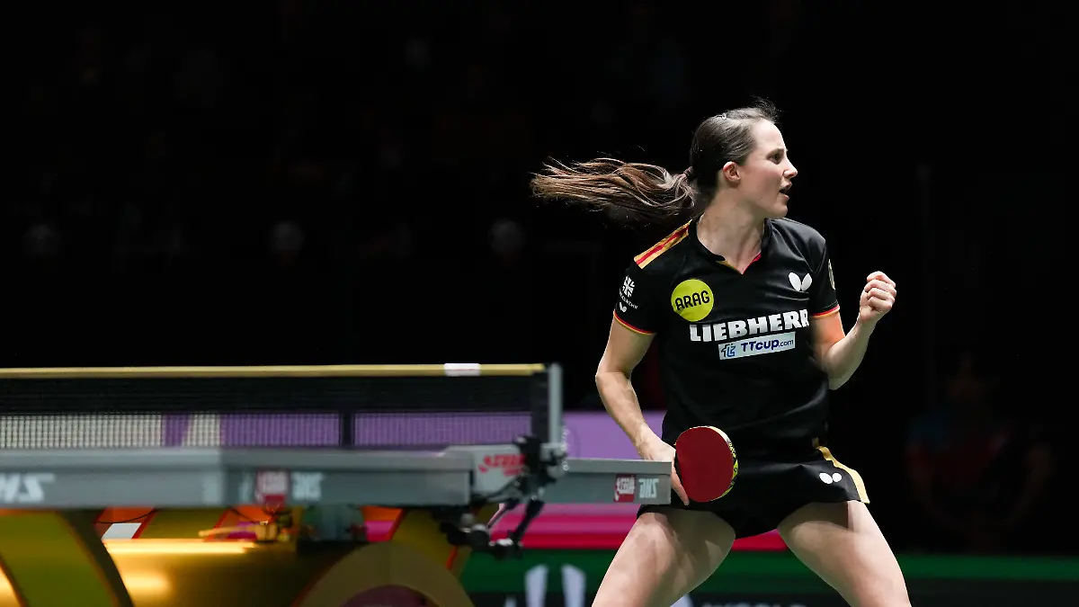 251206-CHENGDU-Dec-6-2025-Sabine-Winter-of-Germany-reacts-in-the-women-s-singles-match-against-Lee-Eunhye-of-South-Korea-during-the-stage-2-group-match-between-Germany-and-South-Korea-at-the-ITTF-Mixed-Team-World-Cup-2025-in-Chengdu-southwest-China-s-Sichuan-Province-Dec-6-2025