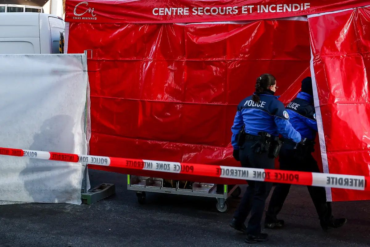 Police-officers-outside-the-Le-Constellation-bar-after-a-fire-and-explosion-during-a-New-Year-s-Eve-party-where-several-people-died-and-others-were-injured-according-to-Swiss-police-in-the-upscale-ski-resort-of-Crans-Montana-in-southwestern-Switzerland-January-2-2026