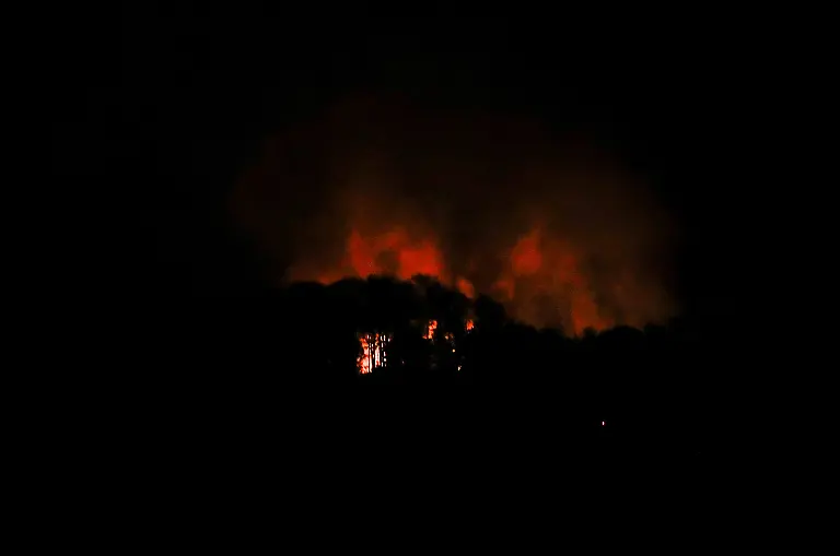 Smoke-rises-near-Fort-Tiuna-a-military-zone-during-a-full-blackout-following-explosions-and-loud-noises-amid-rising-tensions-between-administrations-of-U-S-President-Donald-Trump-and-Venezuelan-President-Nicolas-Maduro-in-Caracas-Venezuela-January-3-2026