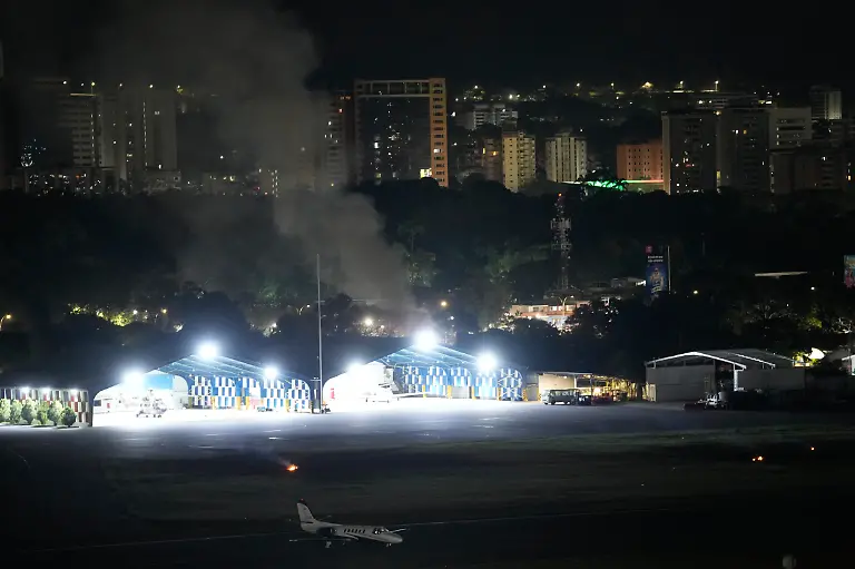 Smoke-raises-at-La-Carlota-airport-after-explosions-and-low-flying-aircraft-were-heard-in-Caracas-Venezuela-Saturday-Jan-3-2026