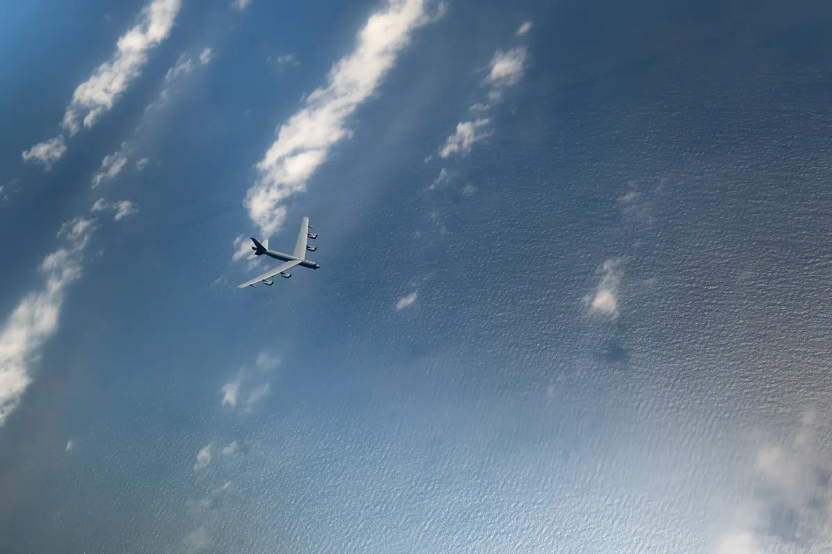 RECORD-DATE-NOT-STATED-A-B-52H-Stratofortress-assigned-to-the-5th-Bomb-Wing-Minot-Air-Force-Base-North-Dakota-flies-below-a-KC-135-Stratotanker-after-aerial-refueling-during-a-routine-Bomber-Task-Force-mission-over-the-Pacific-Ocean-Feb-19-2024-These-missions-enhance-the-U-S-Air-Force-joint-and-multilateral-readiness-to-respond-to-any-potential-crisis-or-challenge-in-the-Indo-Pacific