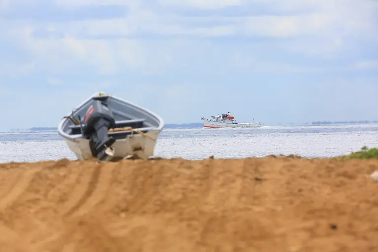 A-fishing-trawler-sails-through-the-strait-known-as-the-Columbus-Channel-as-Trinidad-and-Tobago-s-Coast-Guard-and-Air-Guard-increase-patrols-amid-rising-tensions-between-the-United-States-and-Venezuela-at-Icacos-village-Trinidad-and-Tobago-October-19-2025