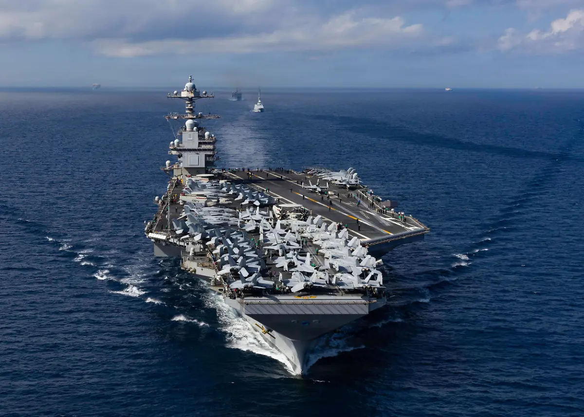 October-1-2025-Mediterranean-Sea-International-Waters-The-U-S-Navy-Ford-class-aircraft-carrier-USS-Gerald-R-Ford-leads-a-formation-of-ships-from-the-Royal-Moroccan-Navy-during-a-transit-of-the-Strait-of-Gibraltar-October-1-2025-on-the-Mediterranean-Sea-U-S-President-Trump-ordered-the-Ford-Carrier-Group-to-the-Caribbean-on-October-24th-in-a-show-of-force-against-Venezuela-Mediterranean-Sea-International-Waters-ZUMAp138-20251001-zaa-p138-001-Copyright-xMcsxAlyssaxJoy-U-S