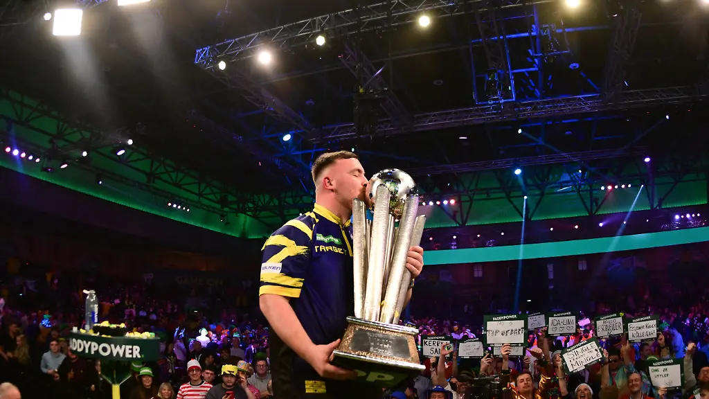 03-01-2026-2025-26-World-Darts-Championship-Luke-Littler-kisses-the-trophy-during-the-2025-26-Paddy-Power-World-Darts-Championships-final-at-Alexandra-Palace-London-United-Kingdom-on-3-January-2026