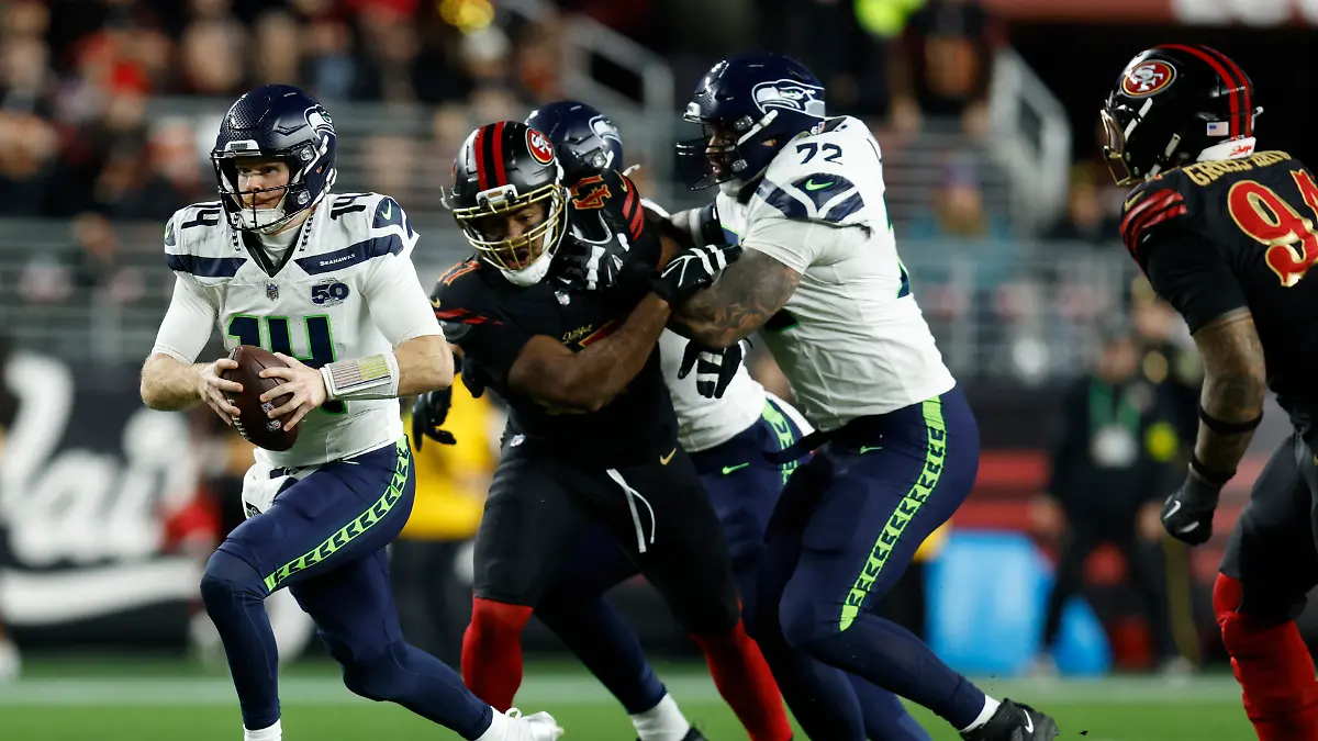 Jan-3-2026-Santa-Clara-California-USA-Seattle-Seahawks-quarterback-Sam-Darnold-14-rushes-the-ball-against-the-San-Francisco-49ers-during-the-first-half-at-Levi-s-Stadium