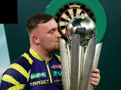 Darts World Darts Championship Alexandra Palace London Britain January 3 2026 Luke Littler Celebrates With The Trophy After Winning The World Darts Championship Action Images Via Reuters Paul Childs