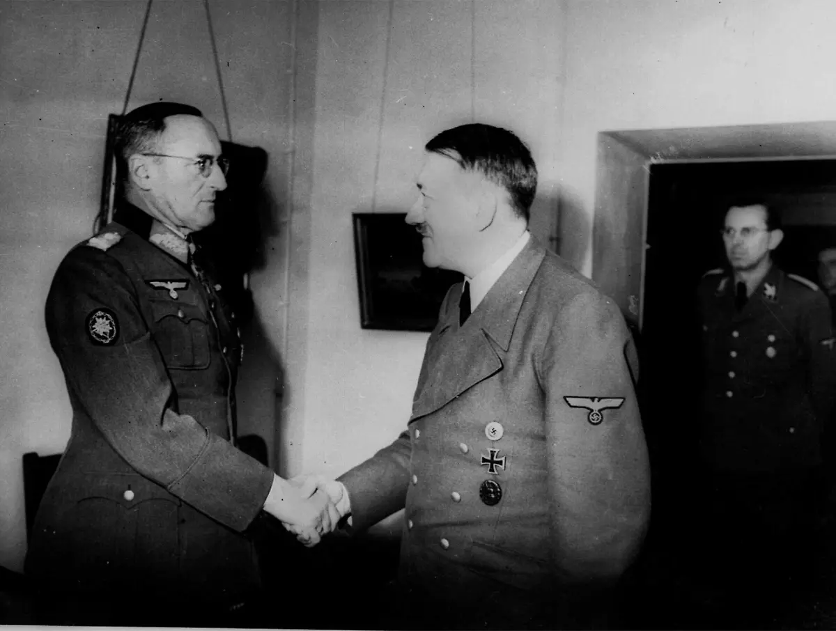 This-is-one-of-the-last-pictures-taken-of-Adolf-Hitler-in-his-bunker-in-Berlin-in-1945-as-he-shakes-hands-with-Col-General-Schoerner-appointed-commander-in-chief-of-the-non-existent-Wehrmacht-in-Hitler-s-last-will-and-testament-In-doorway-is-Hitler-s-adjustant-Julius-Schaub