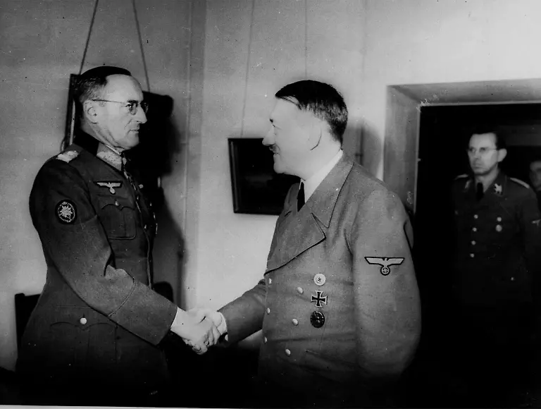 This-is-one-of-the-last-pictures-taken-of-Adolf-Hitler-in-his-bunker-in-Berlin-in-1945-as-he-shakes-hands-with-Col-General-Schoerner-appointed-commander-in-chief-of-the-non-existent-Wehrmacht-in-Hitler-s-last-will-and-testament-In-doorway-is-Hitler-s-adjustant-Julius-Schaub
