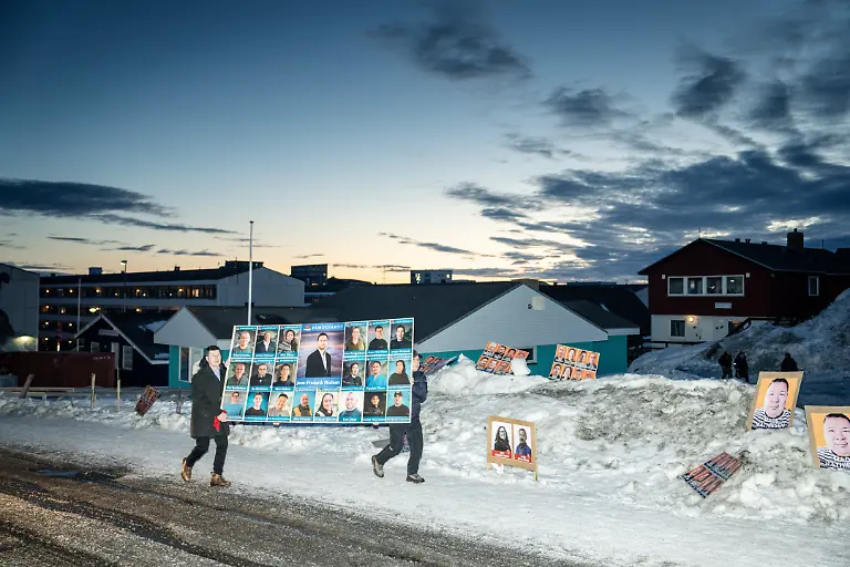 Poster-for-Demokraatit-Jens-Frederik-Nielsen-in-front-of-Godthaabshallen-where-voting-takes-place-in-connection-with-the-parliamentary-election-to-Inatsisartut-in-Nuuk-Greenland-Tuesday-March-11-2025-31-members-are-to-be-elected-to-Inatsisartut-which-is-the-Greenlandic-parliament-based-in-Greenland-s-capital-Nuuk-Six-parties-are-running-in-the-parliamentary-election