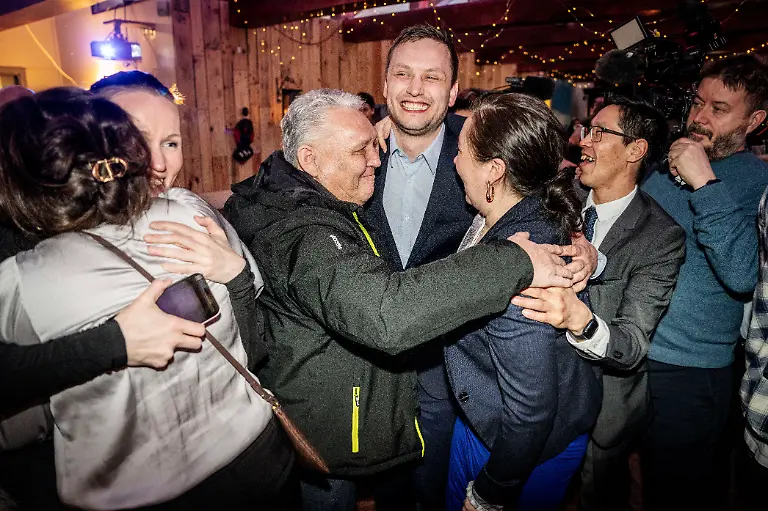 Chairman-of-Demokraatit-Jens-Frederik-Nielsen-center-celebrates-during-the-election-party-at-Demokraatit-by-cafe-Killut-in-Nuuk-early-Wednesday-March-12-2025