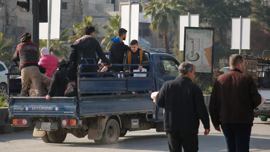 ALEPPO-SYRIA-JANUARY-7-Civil-defense-teams-affiliated-with-Syria-s-Ministry-of-Emergency-and-Disaster-Management-evacuate-families-trapped-in-their-homes-in-various-neighborhoods-to-shelter-centers-in-Aleppo-Syria-on-January-7-2026-Clashes-that-began-after-attacks-by-the-terrorist-organization-PKK-YPG-which-operates-under-the-name-SDF-in-Syria-PKK-listed-as-a-terrorist-organization-by-Turkiye-the-U-S-and-the-EU-and-YPG-which-Turkiye-consider-as-the-extension-of-PKK-in-Syria-on-civilian-settlements-and-the-Syrian-army-in-Aleppo-continued-into-their-second-day