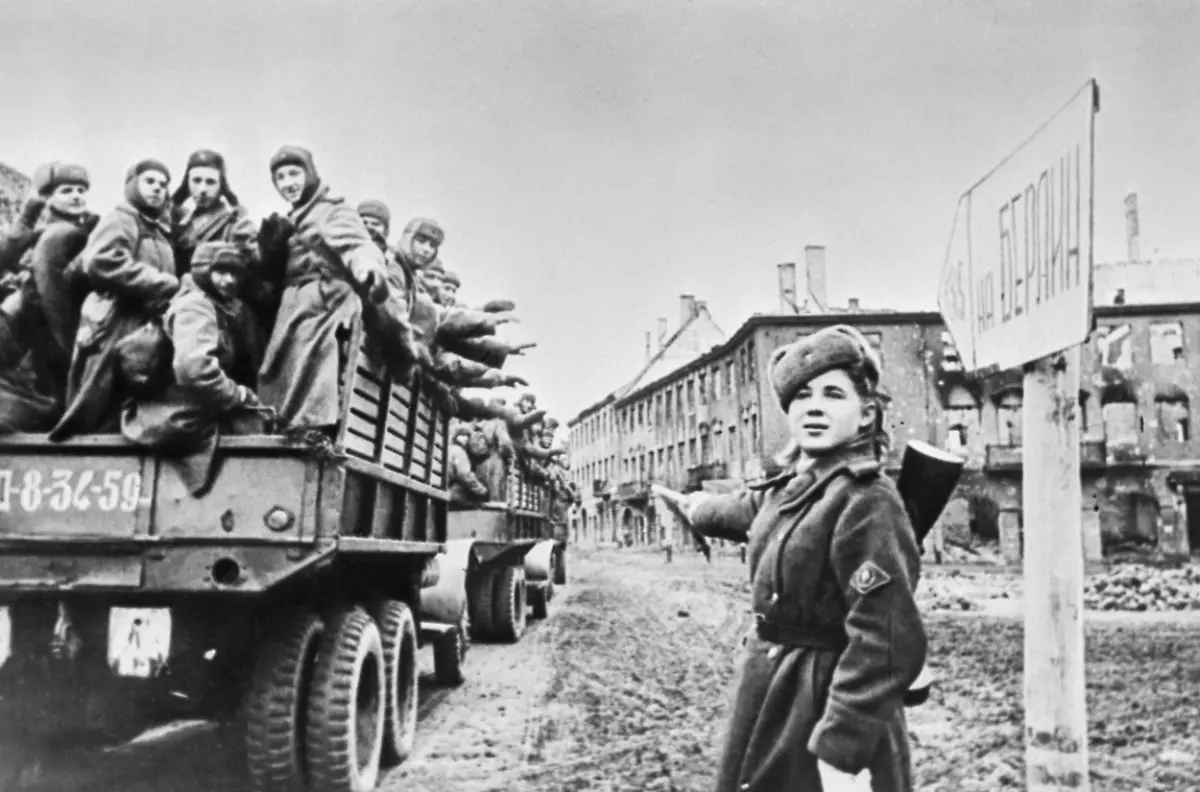 Germany-April-1945-Soviet-regulator-shows-the-direction-of-traffic-at-a-crossroad-near-a-sign-To-Berlin-during-sending-reinforcements-to-the-Red-Army-within-the-framework-of-the-Berlin-Strategic-Offensive-Operation-in-the-Second-World-War-The-exact-date-and-location-of-the-photograph-is-unknown-The-highest-quality-available