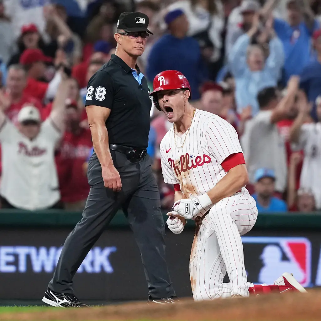 Philadelphia-Phillies-Max-Kepler-reacts-after-hitting-a-triple-during-the-eighth-inning-in-Game-2-of-baseball-s-National-League-Division-Series-against-the-Los-Angeles-Dodgers-Monday-Oct-6-2025-in-Philadelphia