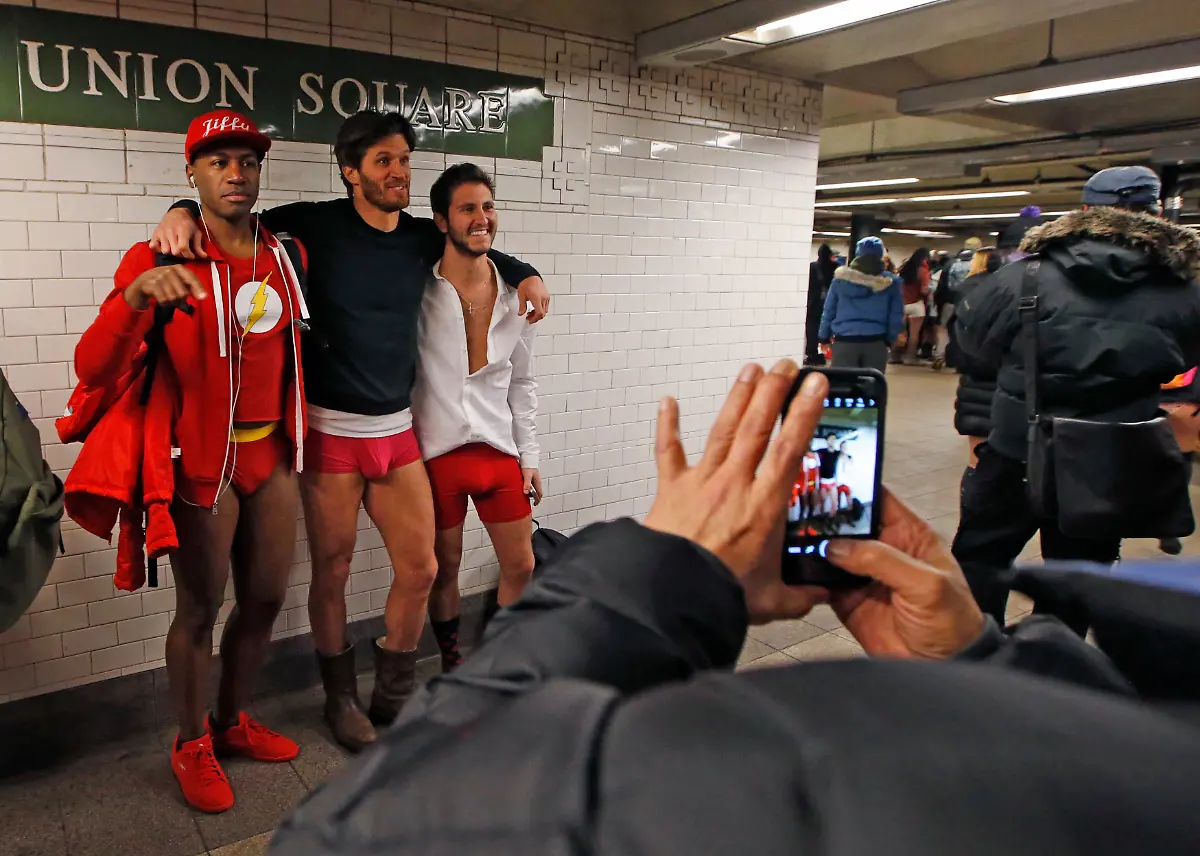 Three-men-pose-in-their-underwear-in-front-of-a-Union-Square-subway-station-sign-during-the-16th-annual-No-Pants-Subway-Ride-Sunday-Jan-8-2017-in-New-York-Created-in-2002-by-Charlie-Todd-of-Improv-Everywhere-the-sponsoring-group-aims-to-surprise-and-delight-random-strangers-through-positive-pranks