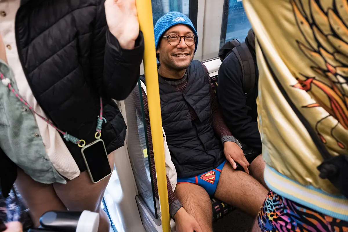 January-12-2025-London-United-Kingdom-A-participant-poses-for-a-portrait-The-No-Trousers-Tube-Ride-2025-has-taken-place-in-London-this-weekend-This-annual-trouserless-tradition-was-inspired-by-aNo-Pants-Subway-Ridea-started-in-New-York-in-2002-After-gathering-at-Chinatown-the-participants-have-travelled-through-Piccadilly-Circus-Westminster-and-and-finish-at-Waterloo-station