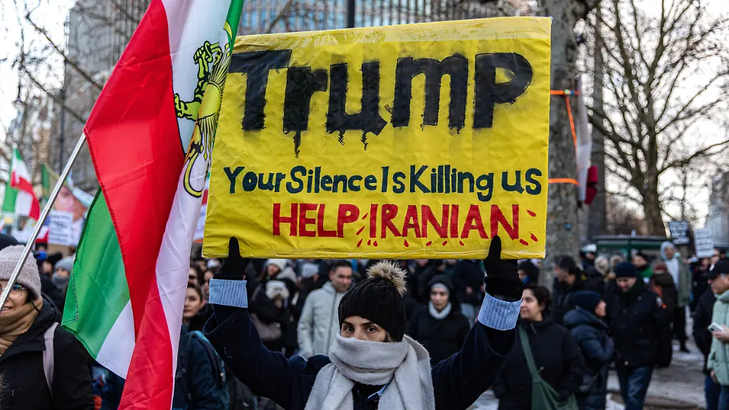 January-10-2026-Berlin-Berlin-Germany-Demonstrators-marched-along-BerlinA-a-a-s-Kurfuerstendamm-on-Saturday-January-10-2026-waving-pre-1979-Iranian-flags-and-chanting-against-IranA-a-a-s-clerical-leadership-as-protests-inside-Iran-amid-reports-of-killings-and-mass-arrests-by-security-forces-Protesters-shouted-the-name-of-exiled-opposition-figure-Reza-Pahlavi-saying-they-hope-he-can-lead-a-political-transition-while-denouncing-Ali-Hosseini-Khamenei-and-the-Islamic-Republic-Israeli-flags-were-visible-among-the-crowd-alongside-placards-in-English-urging-U-S-President-Donald-Trump-to-act-with-slogans-reading-A-a-AYour-silence-is-killing-us-A-a-A-A-a-AHelp-Iran-A-a-A-and-A-a-AIranian-people-are-counting-on-you-A-a-A-as-organizers-said-the-rally-sought-to-draw-international-attention-to-the-deadly-crackdown-internet-shutdowns-and-the-protestersA-a-a-demand-for-regime-change