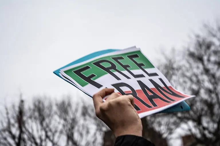 January-9-2026-New-York-New-York-USA-A-protest-in-support-of-Iran-was-organized-mainly-through-social-media-in-Washington-Square-Park-A-man-holds-a-sign-that-reads-Free-Iran