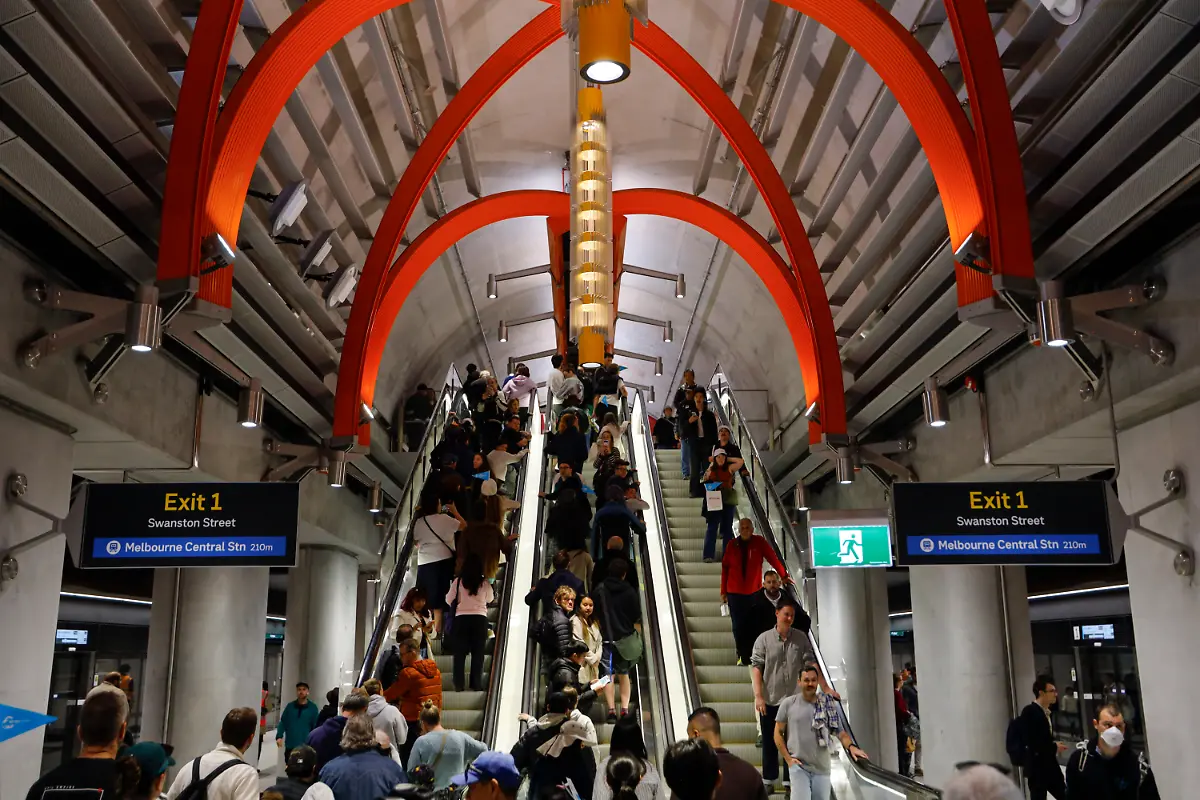 November-30-2025-Melbourne-Victoria-State-Australia-Passengers-are-seen-inside-the-new-station-The-Metro-Tunnel-officially-opens-to-the-public-on-30-November-2025-marking-one-of-Victoriaas-largest-transport-upgrades-in-decades-The-project-delivers-five-new-underground-stationsaArden-Parkville-State-Library-Town-Hall-and-Anzacaconnecting-key-areas-across-Melbourneas-CBD-and-inner-suburbs-The-new-tunnel-separates-the-Sunbury-and-Cranbourne-Pakenham-lines-from-the-City-Loop-to-increase-capacity-reduce-congestion-and-improve-reliability-across-the-network-Opening-day-sees-trains-running-through-the-new-route-for-the-first-time-with-passengers-exploring-the-modern-stations-upgraded-platforms-and-redesigned-interchange-connections