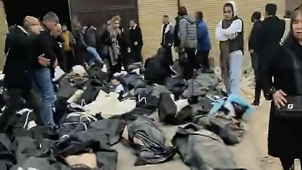 Kahrizak-Tehran-Iran-11-01-2026-People-gather-at-the-Kahrizak-area-south-of-Tehran-on-January-11-2026-where-Irans-central-forensic-medicine-and-coroner-facilities-are-located-as-families-and-citizens-confront-the-sight-of-hundreds-of-bodies-of-protesters-killed-by-the-regimes-security-forces-during-the-ongoing-nationwide-uprising-The-scene-reflects-the-scale-of-lethal-repression-as-reports-indicate-more-than-3-000-people-have-been-killed-across-Iran-since-the-start-of-the-protests-This-video-was-obtained-from-the-Iranian-opposition-group-Peoples-Mojahedin-Organization-of-Iran-PMOI-MEK-MEK-The-Media-Express-SIPA-TME-Sipa