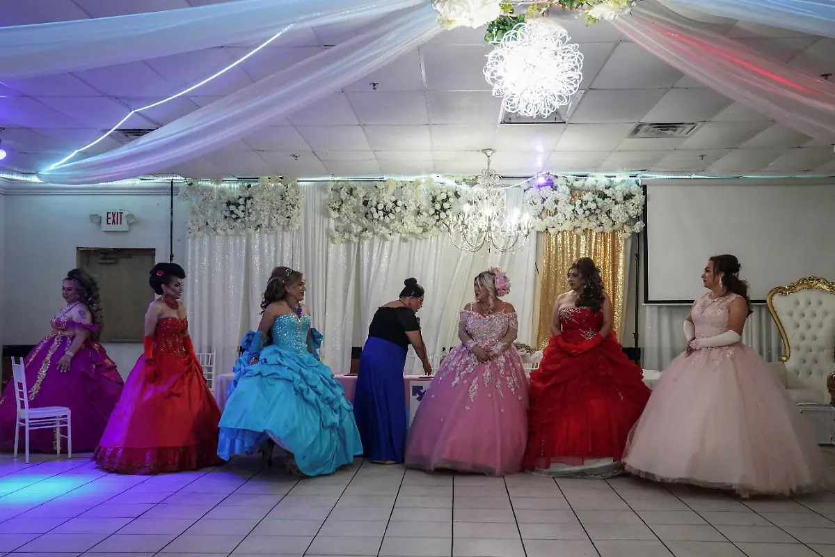 From-left-to-right-Kassandra-Rivas-51-Adriana-Vickymar-Castrellon-54-Ana-Andrea-Noemi-Martinez-54-Dilian-Quijano-58-and-Jessica-Flores-49-line-up-for-the-next-part-of-the-celebration-at-a-ballroom-in-Houston-Texas-U-S-May-14-2025-Rivas-and-other-transgender-Latina-immigrants-were-recently-able-to-celebrate-this-year-as-quinceaneras-thanks-to-the-Organizacion-Latina-de-Trans-en-Texas-a-group-promoting-rights-for-LGBTQ-people-including-transgender-women-from-Latin-America-Something-inside-me-held-a-longing-to-experience-this-moment-as-a-girl-as-a-15-year-old-Rivas-said-I-imagined-myself-standing-before-the-priest-in-church-wearing-a-dress-like-any-other-woman-REUTERS-Gabriel-V-Cardenas-SEARCH-CARDENAS-U-S-QUINCEANERAS-FOR-THIS-STORY-SEARCH-WIDER-IMAGE-FOR-ALL-STORIES-THIS-IMAGE-IS-ONLY-FOR-USE-WITH-THE-STORY-USA-LGBTQ-QUINCEANERAS-NO-STANDALONE-USES