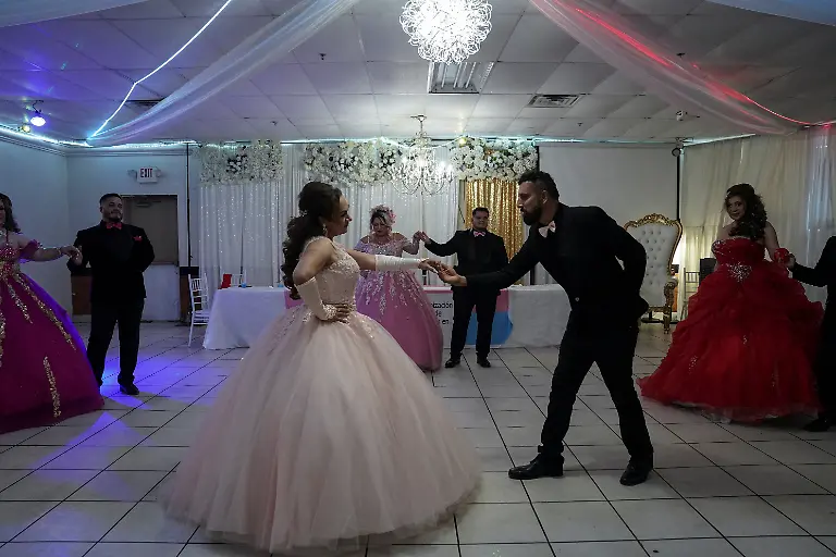 Jessica Flores, 49, dances to Tiempo de Vals by Chayanne with her chambelan Jorge Soto