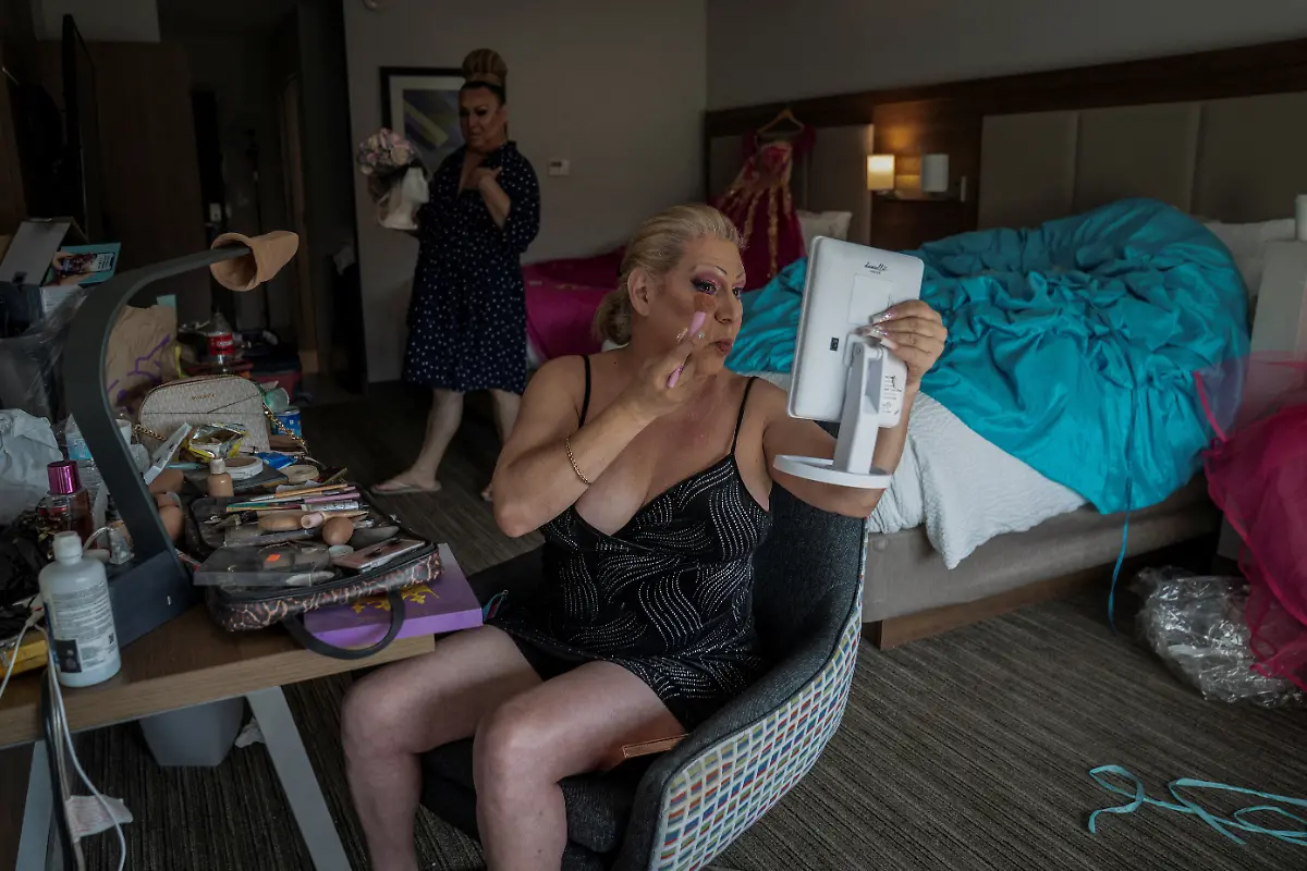 Noemi-Martinez-R-54-and-Kassandra-Rivas-51-get-ready-for-their-quinceanera-at-a-hotel-in-Houston-Texas-U-S-May-14-2025-Rivas-Martinez-and-other-transgender-Latina-immigrants-were-recently-able-to-celebrate-this-year-as-quinceaneras-thanks-to-the-Organizacion-Latina-de-Trans-en-Texas-a-group-promoting-rights-for-LGBTQ-people-including-transgender-women-from-Latin-America-Something-inside-me-held-a-longing-to-experience-this-moment-as-a-girl-as-a-15-year-old-Rivas-said-I-imagined-myself-standing-before-the-priest-in-church-wearing-a-dress-like-any-other-woman-REUTERS-Gabriel-V-Cardenas-SEARCH-CARDENAS-U-S-QUINCEANERAS-FOR-THIS-STORY-SEARCH-WIDER-IMAGE-FOR-ALL-STORIES-THIS-IMAGE-IS-ONLY-FOR-USE-WITH-THE-STORY-USA-LGBTQ-QUINCEANERAS-NO-STANDALONE-USES